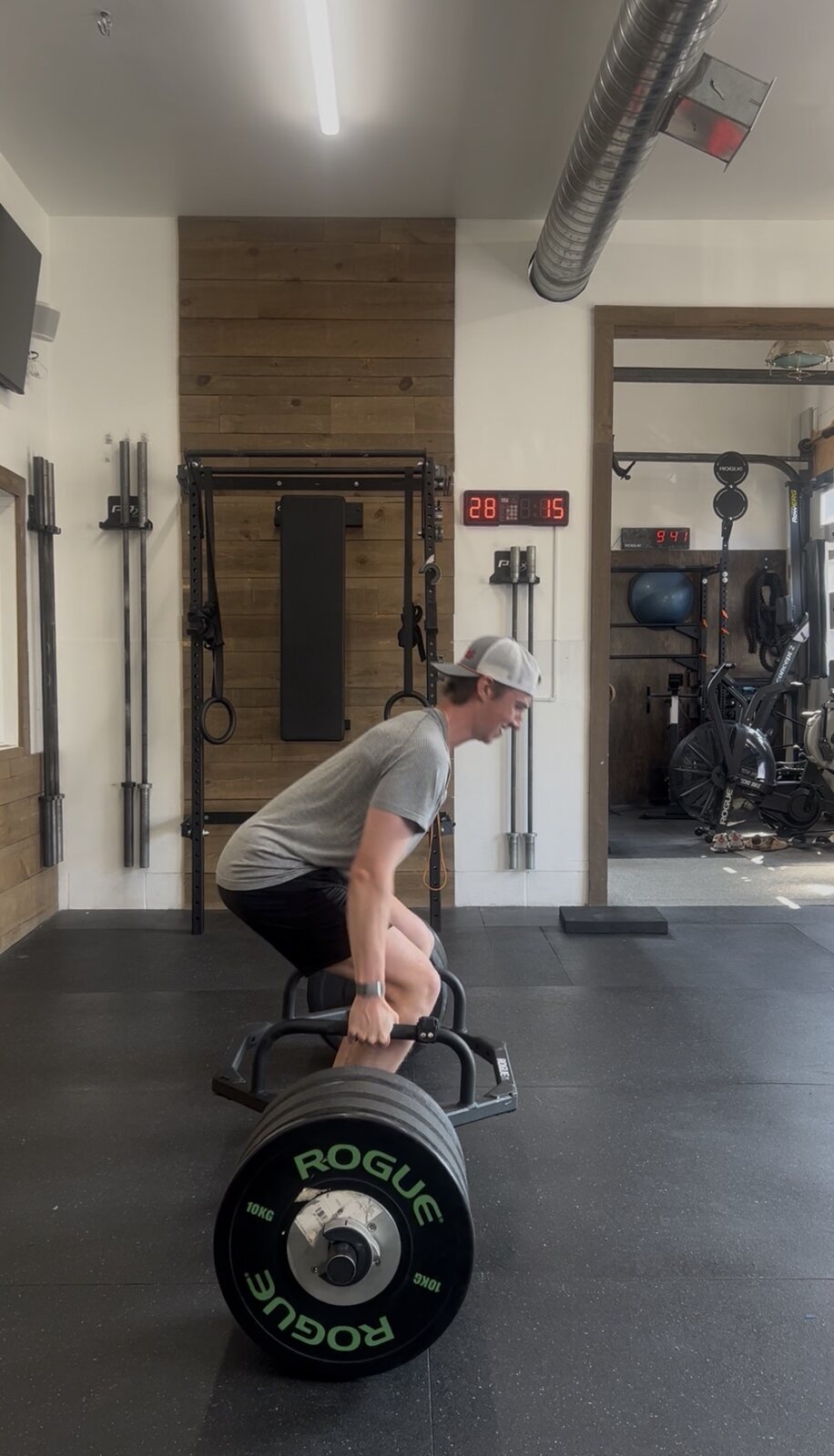 Athlete performing a loaded strength exercise